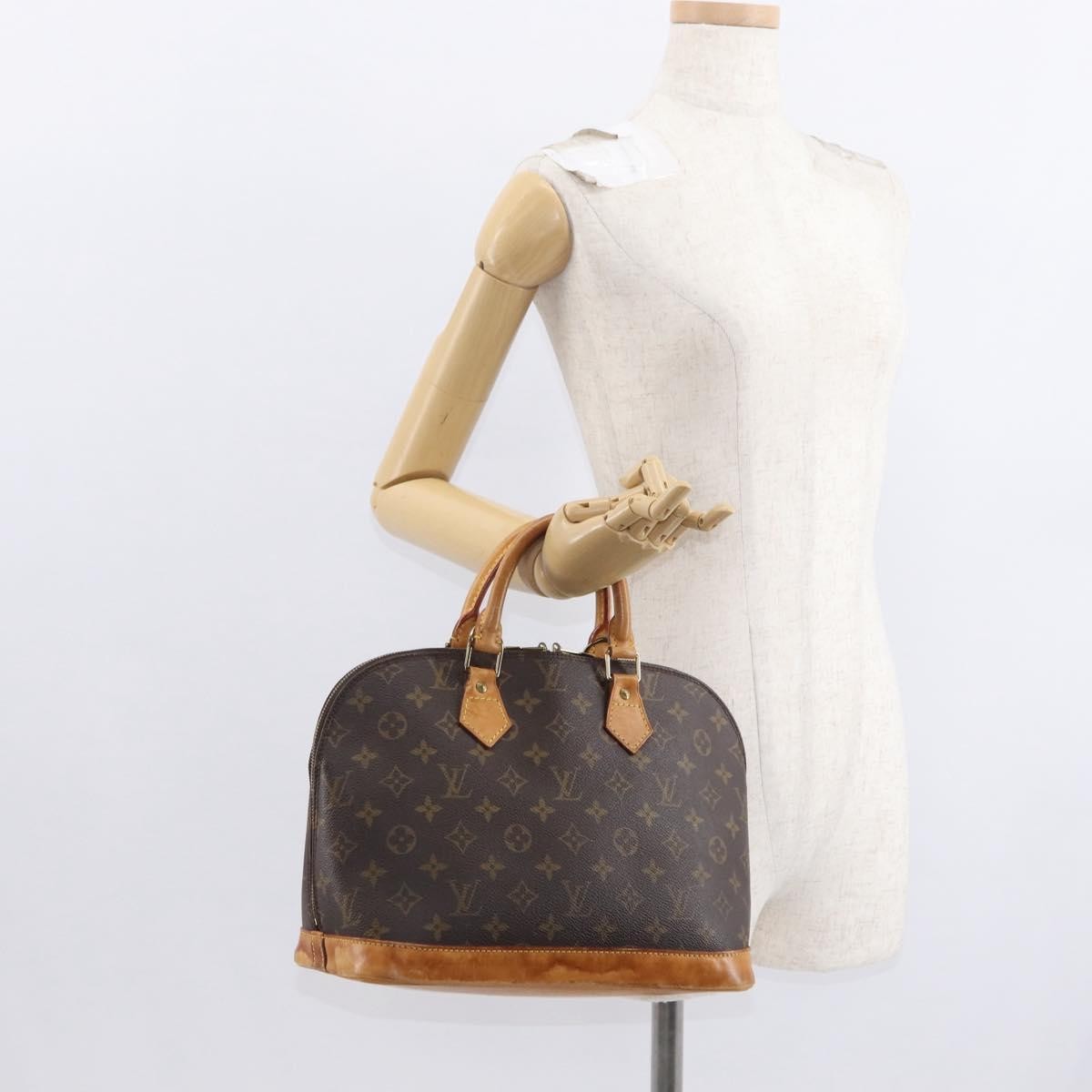 Louis Vuitton Alma Handbag Monogram Canvas Brown Canvas Handbag (Pre-Owned)